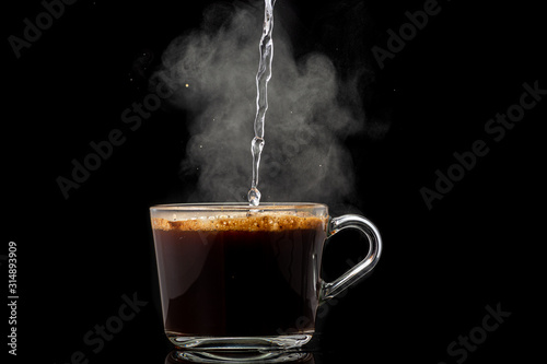making instant coffee in a mug on a black background