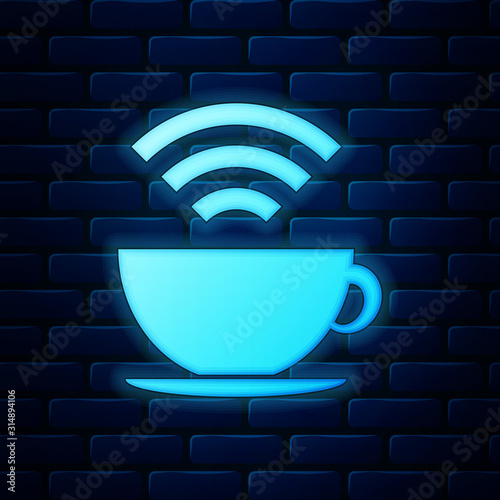Glowing neon Cup of coffee shop with free wifi zone icon isolated on brick wall background. Internet connection placard. Vector Illustration