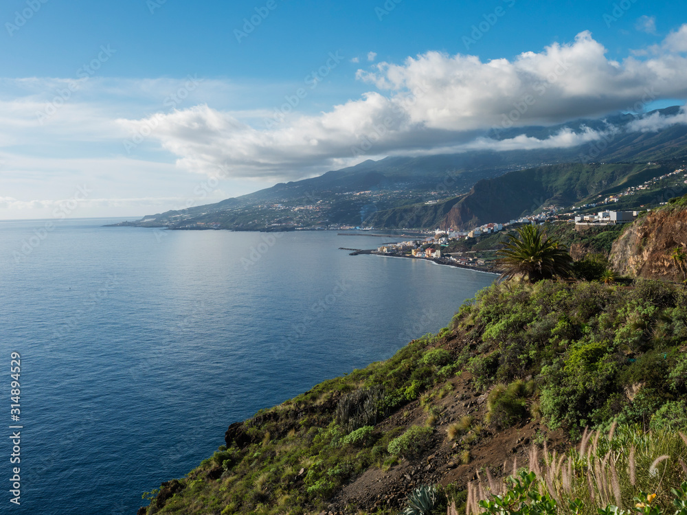 La Palma, Canary Islands, view from viewpoint Mirador de San Juanito with view on Santra Cruz de la Palma and ocean. Blue sky background