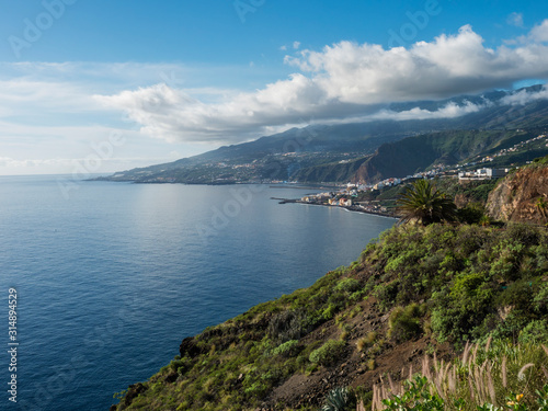 La Palma, Canary Islands, view from viewpoint Mirador de San Juanito with view on Santra Cruz de la Palma and ocean. Blue sky background