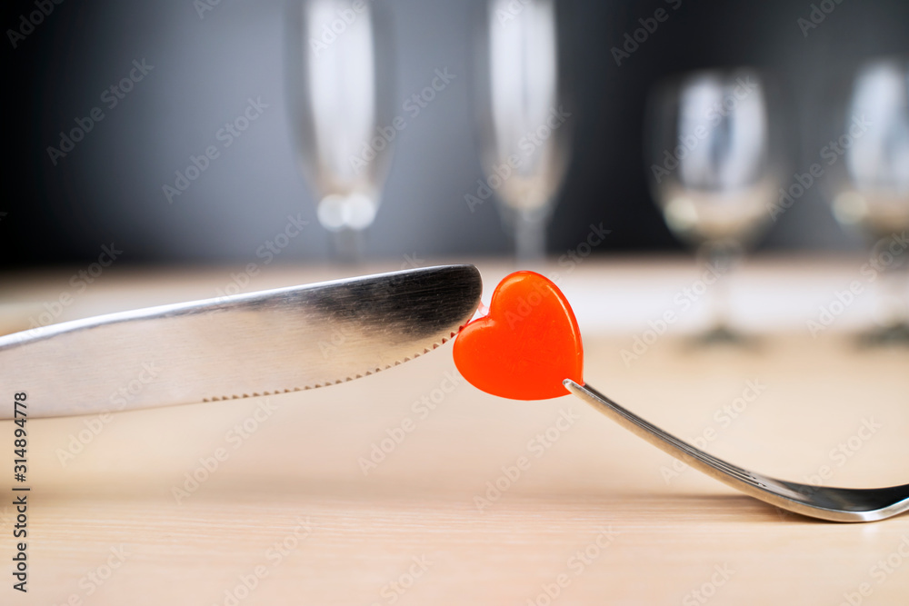 Cutting and eating a candy with fork and knife Cutting and eating a candy with fork and knife