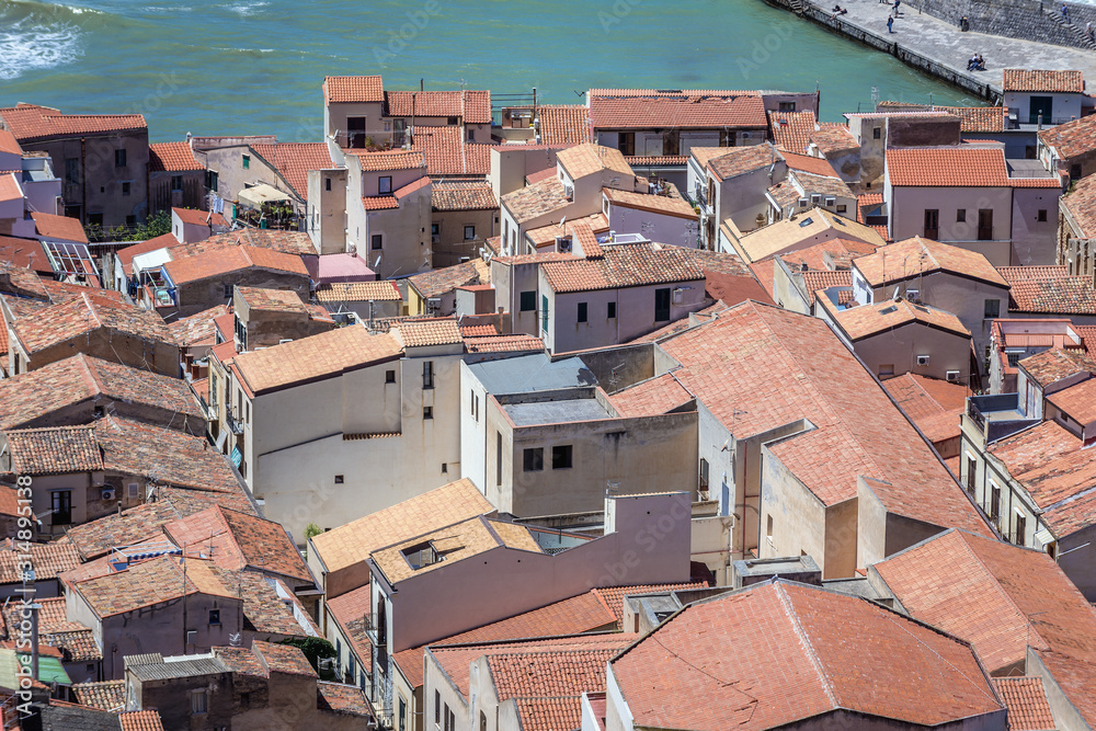 Red tiled oofs in historic part of Cefalu city, view from Cefalu Rock on Sicily Island in Italy