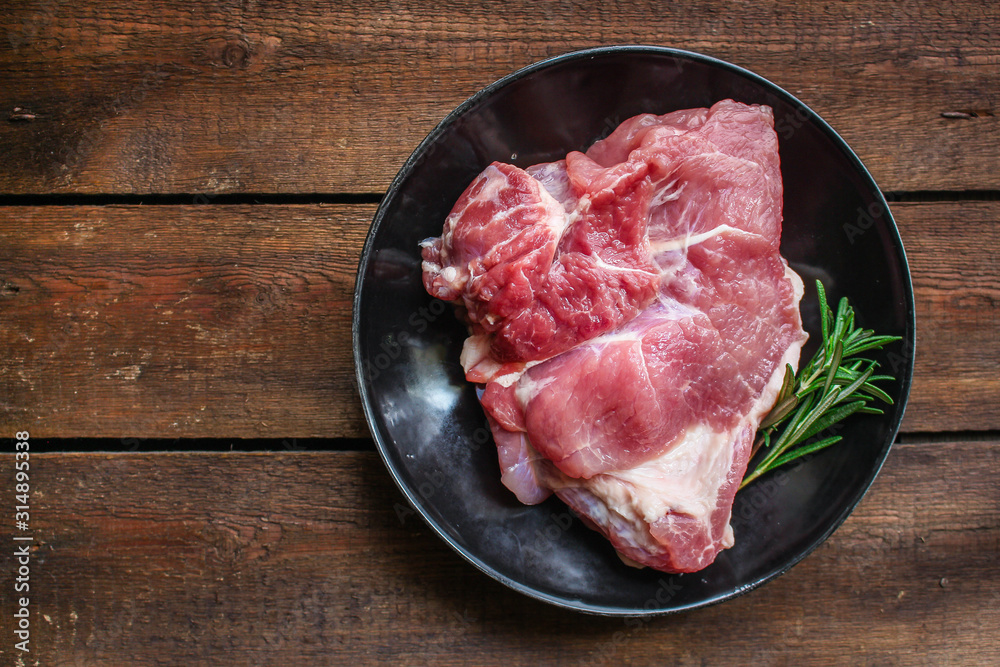 raw meat, piece of pork (healthy food, vitamins ingredients) menu concept. food background. top view. copy space raw meat, piece of pork (healthy food, vitamins ingredients) menu concept. food background. top view. copy space
