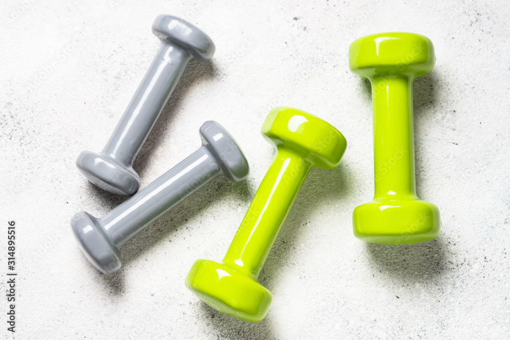 Dumbbells on white background top view. Dumbbells on white background top view.