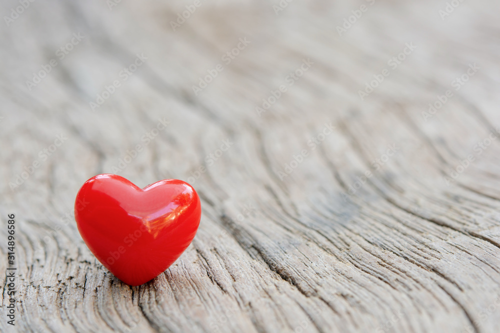 Fototapeta premium Valentines Day background with red hearts on plank wooden, copy space.