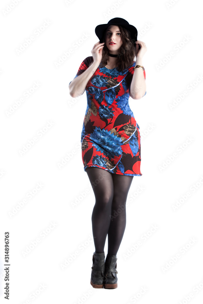 Fototapeta premium beautiful female fashion model wearing a stylish glamour dress is posing in various positions in the photo studio. white background in isolated space. elegant lifestyle with luxury appeal 