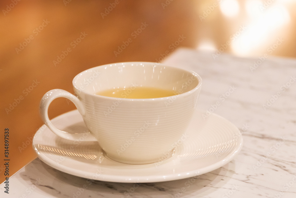 Cup of tea on the table with blur background at cozy cafe and restaurant. Cup of tea on the table with blur background at cozy cafe and restaurant.