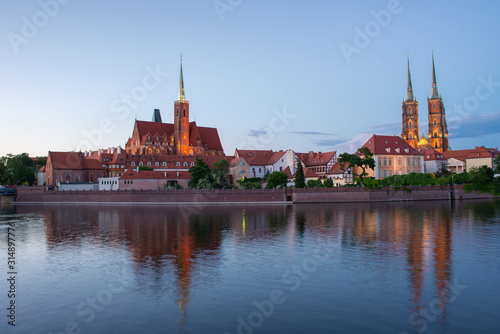 The view of Cathedral island Tumski from the opposite side of the Oder river. The Cathedral of St. John the Baptist. Church of St. Bartholomew.