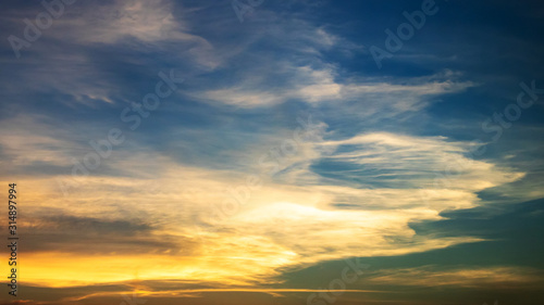 Dramatic sunrise sky shades of the orange, natural background. © pjjaruwan