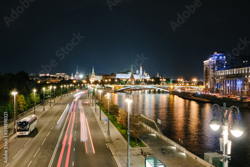 MOSCOW, RUSSIA - AUGUST, 2019: Moscow Kremlin and bridge through Moscow River at night