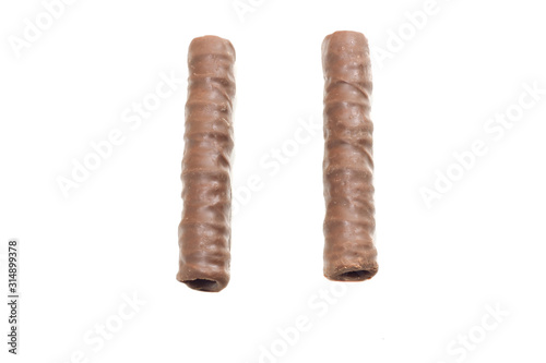 two chocolate tubules on a white isolated background