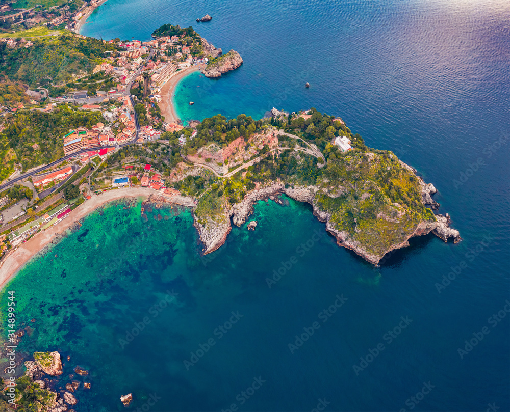 Straight-down view from flying drone. Aerial morning view of Bella island. Colorful spring seascape of Mediterranean sea, Mazzaro' town, Sicily, Itale, Europe. Traveling concept background.