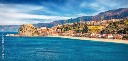 Fototapeta Naklejka Na Ścianę i Meble -  Panoramic morning view of Scilla town with Ruffo castle on background, administratively part of the Metropolitan City of Reggio Calabria, Italy, Europe. Stunning spring seascape of Mediterranean sea.