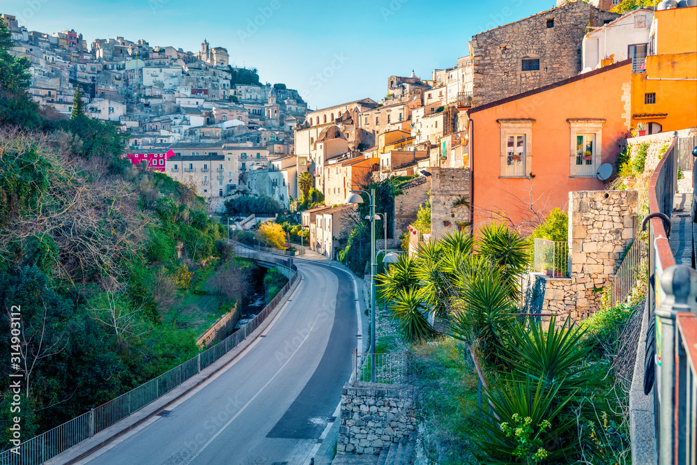 Beautiful spring cityscape of Ragusa town with Santa Maria dell'Itria church on background. Bright morning scene of Sicily, Italy, Europe. Traveling concept background..