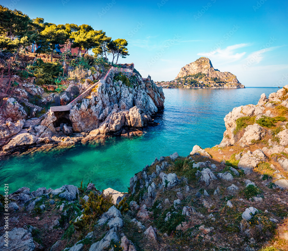 Sunny spring view of Santa Elia cape with Zafferano mountain on background. Picturesque azure water bay on Sicily, Palermo city location, Italy, Europe. Traveling concept background.