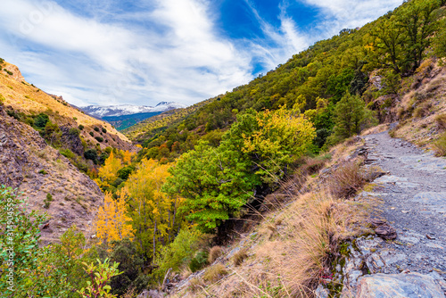 Güéjar-Sierra, Spain - October 27, 2019. Beautiful view from the hiking trail Vereda de la Estrella in the natural park of Sierra Nevada.