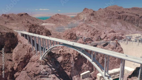 Aerial footage. Hydroelectric power station, built in the lower reaches of Colorado River and the bridge over the river. Reservoire view. Traffic on the bridge road above the Colorado river canyon.
