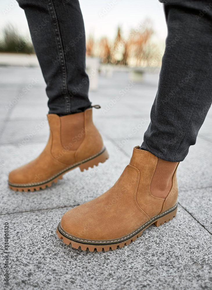 man standing in light suede boots man standing in light suede boots