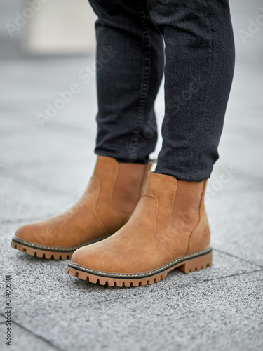 standing man legs in light suede plain boots