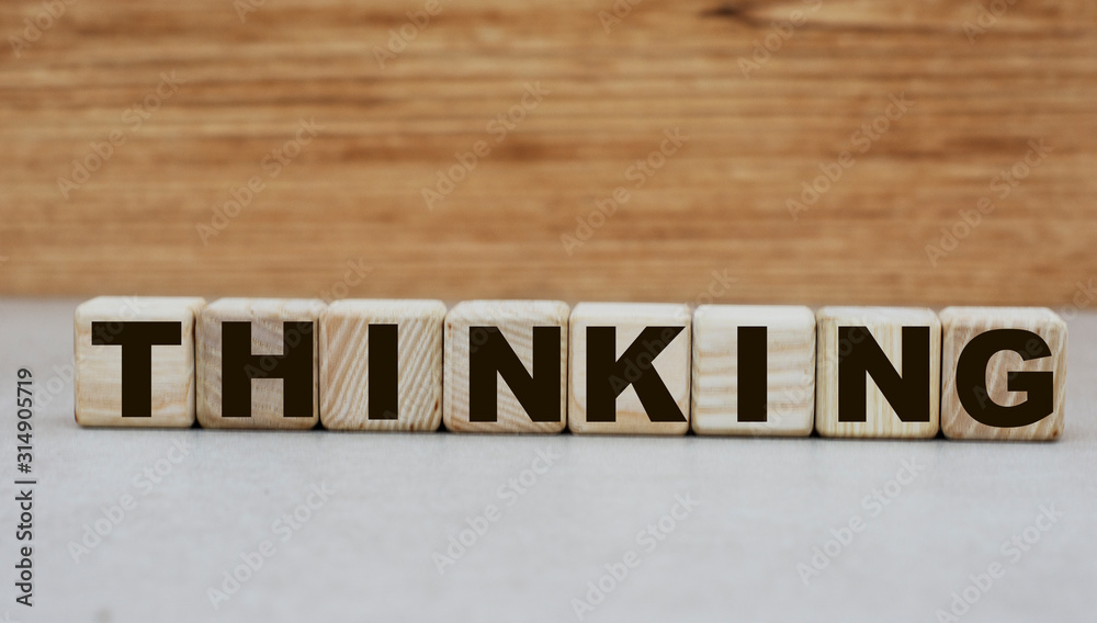 concept word thinking on cubes on a wooden background