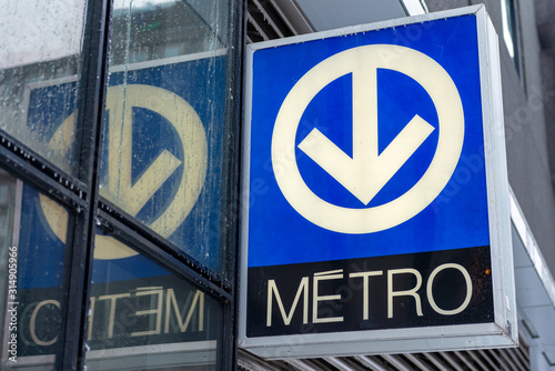 Montreal metro sign with reflection