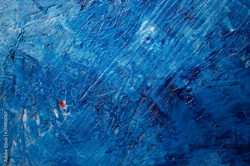 Beautiful blue background on a blackboard with white stains. large brush strokes, acrylic paints