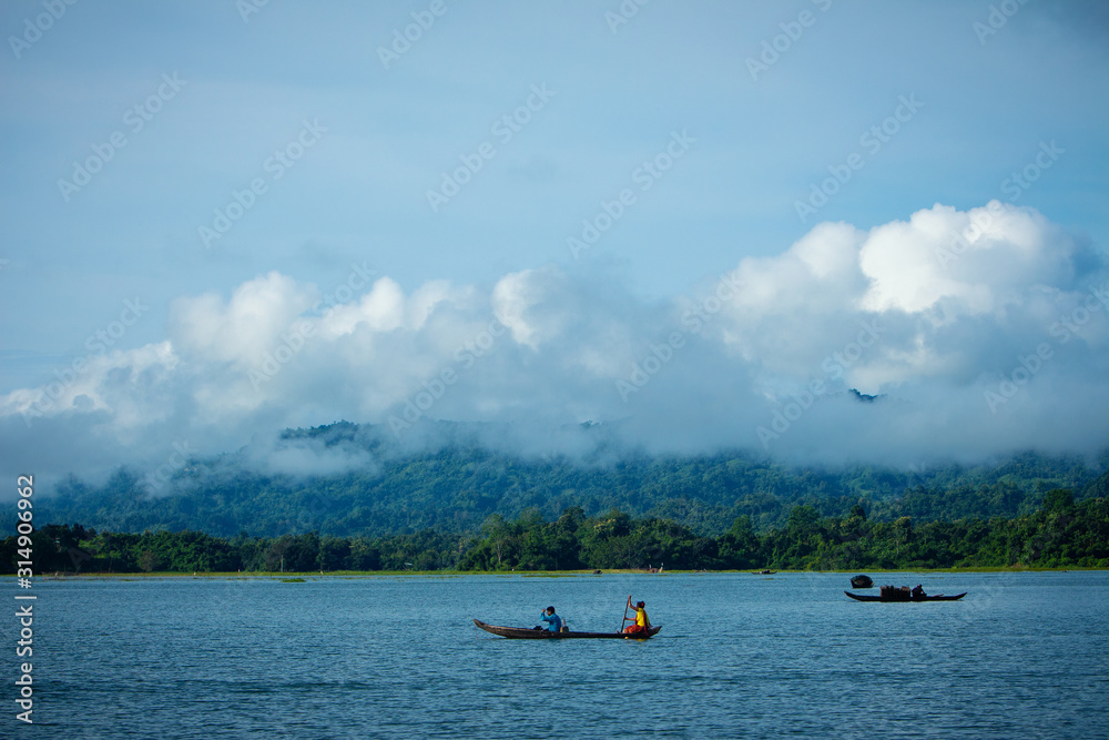 The view of Kaptai lake, a boat woman is working for her lives