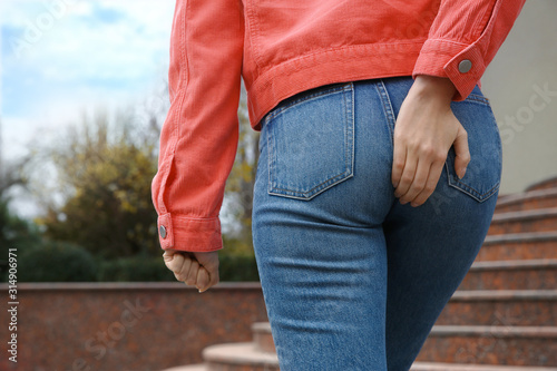 Cuadro en lienzo Woman suffering from hemorrhoid pain outdoors, closeup