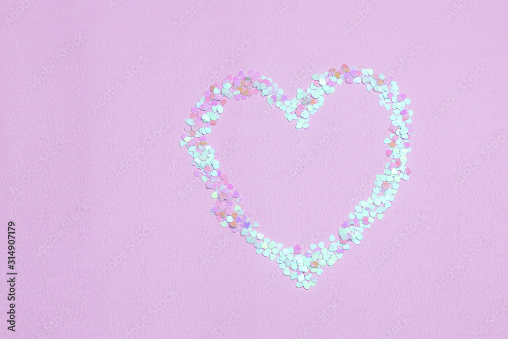 Confetti heart. Valentine’s day composition. Heart made from confetti on pink background. Part of set.