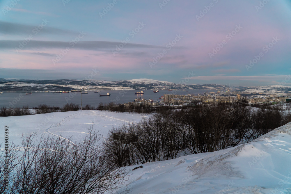 Winter views of the city and the Kola Bay from high hills in the vicinity of Murmansk. Winter views of the city and the Kola Bay from high hills in the vicinity of Murmansk.