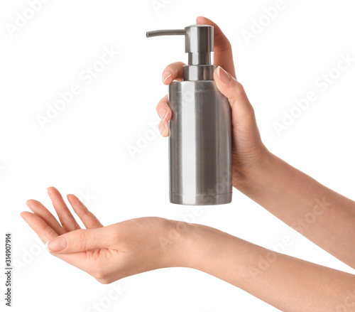 Woman holding soap dispenser on white background, closeup