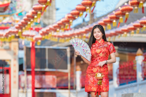 Beautiful Asian model wearing traditional Cheongsam.happy Chinese new year