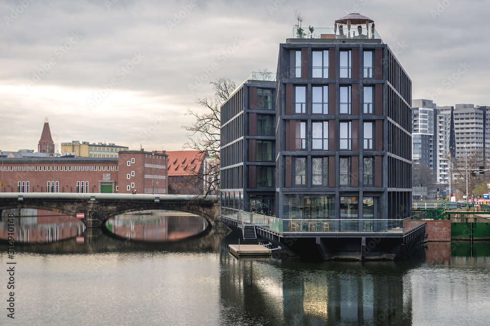 Naklejka premium Apartment house on the Oder River island in Wroclaw city, Poland
