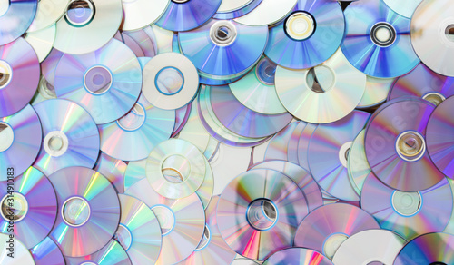 Old technology, waste compact disc collection decoration for pattern. cd background concept. photo
