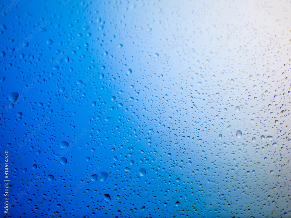 water drops on glass background.Blue water drops. water drops on glass background.Blue water drops.