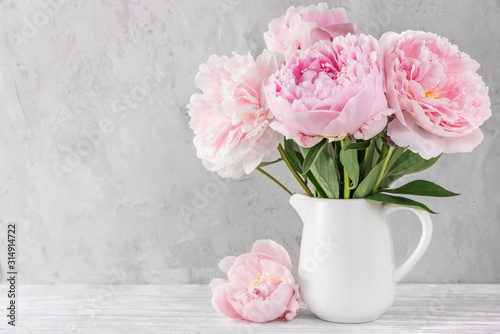 pink peony flowers bouquet on white background with copy space. still life. womens day or wedding concept