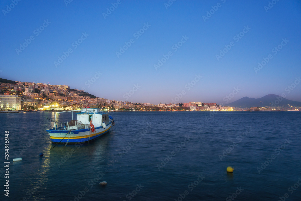 Fishermen boat in the Naples bay (Napoli bay), Italy
