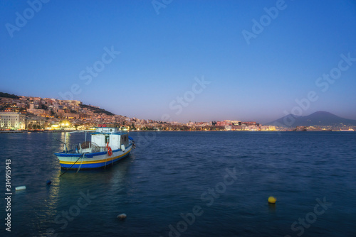 Fishermen boat in the Naples bay (Napoli bay), Italy