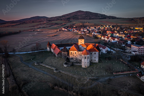 Svihov castle was besieged by Hussite wars, the garrison surrendered after their water moats were siphoned. The castle consists of two residential palaces, five-storey entrance tower on the bastion. photo