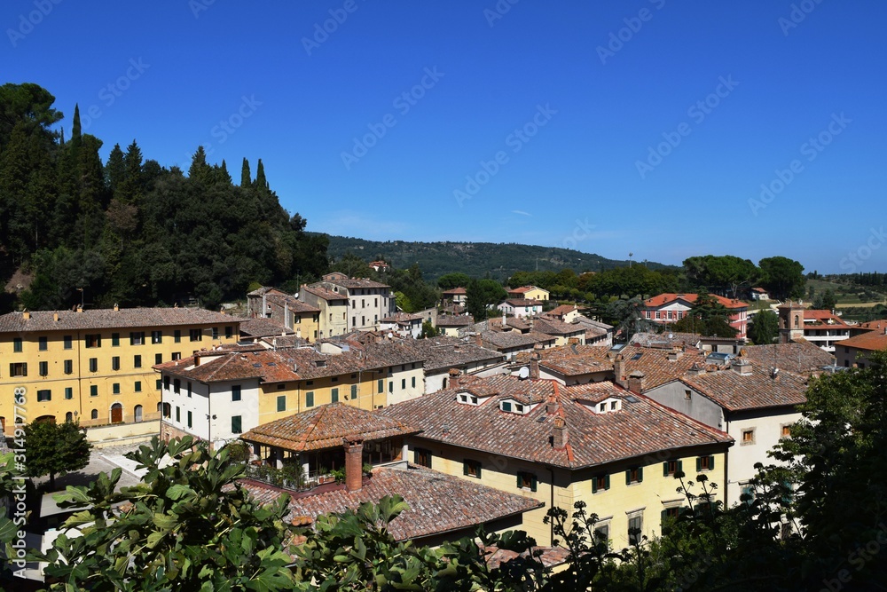 View of an ancient medieval village in the Tuscan countryside.