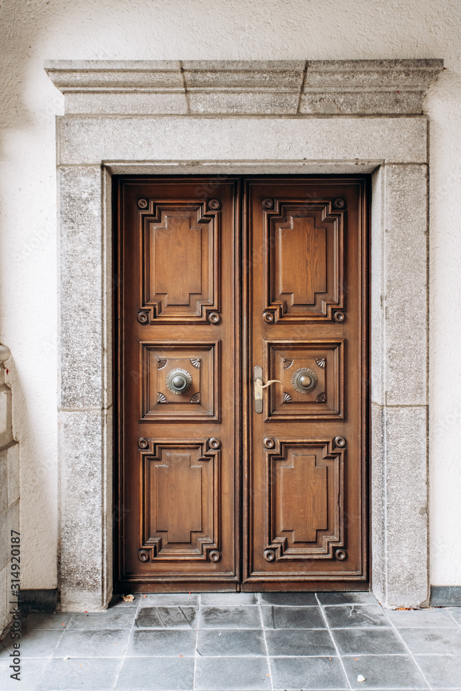 Old wooden door. Old double wooden door in the building Old wooden door. Old double wooden door in the building