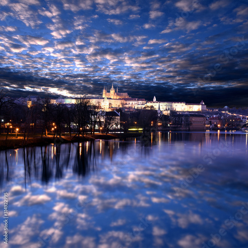 panoramic view To Hradschin Castle  St. Vitus Cathedral And Charles Bridge In Prague  Czech Republic during sunset with dramatic sky