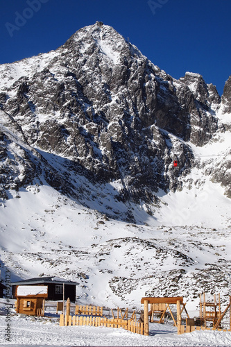 Beautiful winter landscape in Slovakia. Snowy High Tatras on a sunny day. Ski resort Tatranska Lomnica. photo