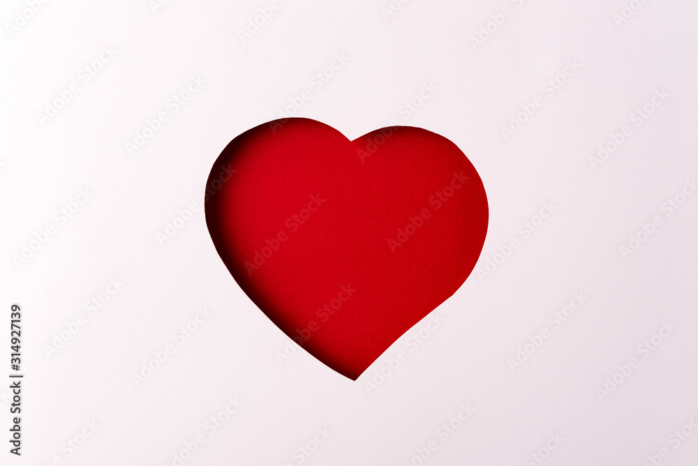 Paper red heart,red background, minimalistic Valentine's day symbol Paper red heart,red background, minimalistic Valentine's day symbol