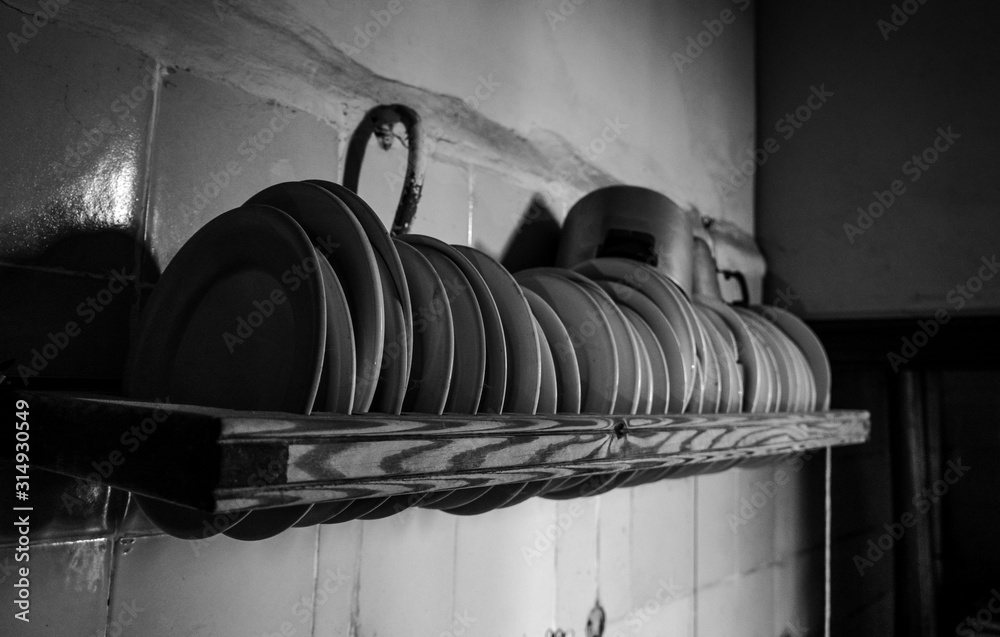 Old dishes on a shelf in the kitchen Old dishes on a shelf in the kitchen