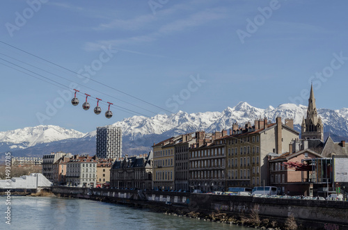 cable-way of Grenoble facing the river and the alps