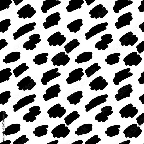 Seamless pattern of black spots on a white background. Animal print. Abstract background. Suitable for printing on fabric.Vector