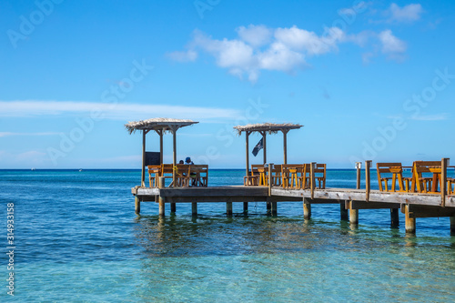 Wooden walkway to eat over the sea at West End beach on Roatan Island. Honduras