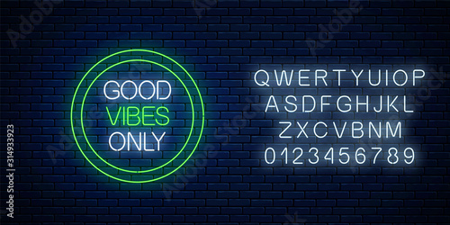 Good vibes only - glowing neon inscription phrase in green circle frame with alphabet. Motivation quote in neon style.