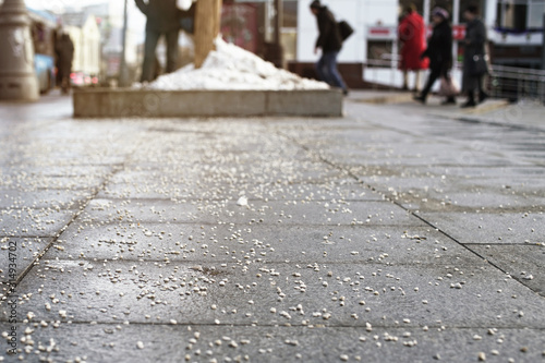 city public service sprinkled slippery pavement with salt photo